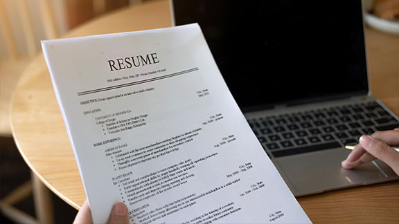 Picture of a person holding a resume