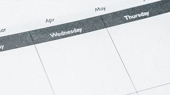 Image of a calendar with different days and months to illustrate weekly online coding classes for kids
