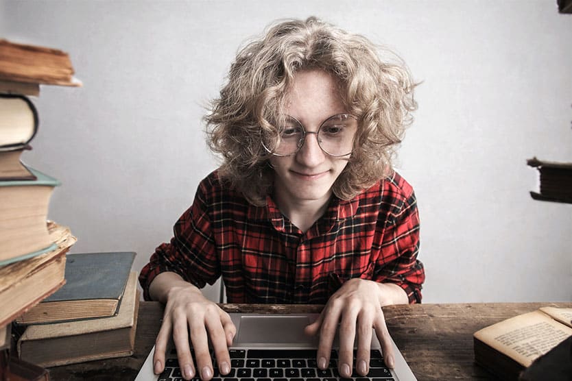 woman at computer, typing with great concentration