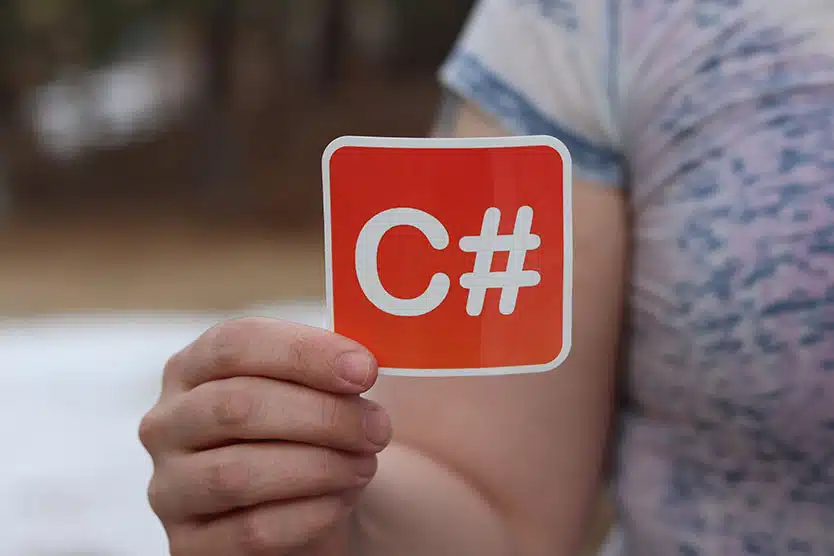 a close up of a sticker with the text 'C#,' a coding language