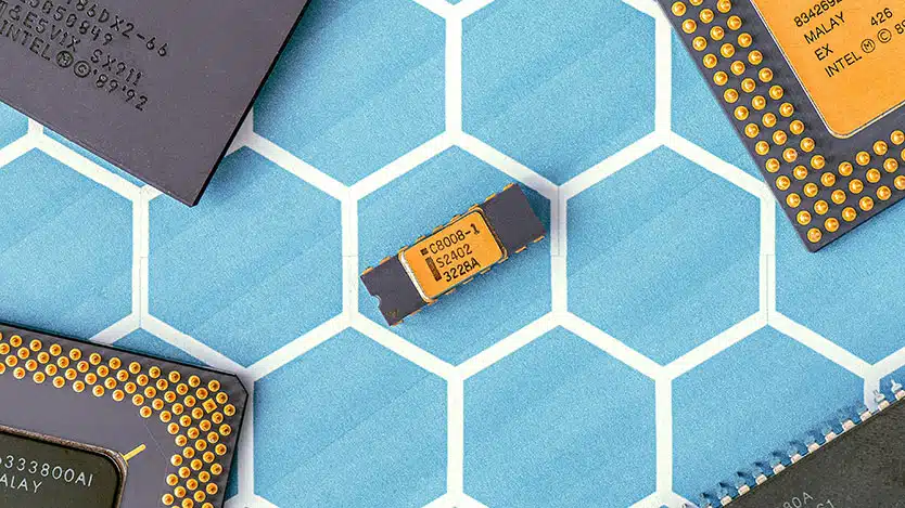 black and yellow microchip, against a blue helix patterned background