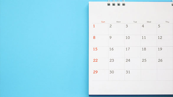 Calendar close up on blue background